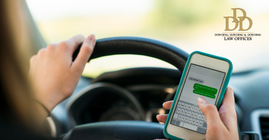 woman driving and texting someone